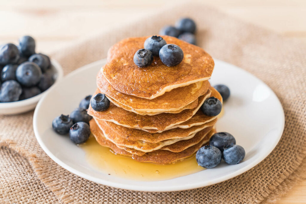Pancakes with syrup and blueberries